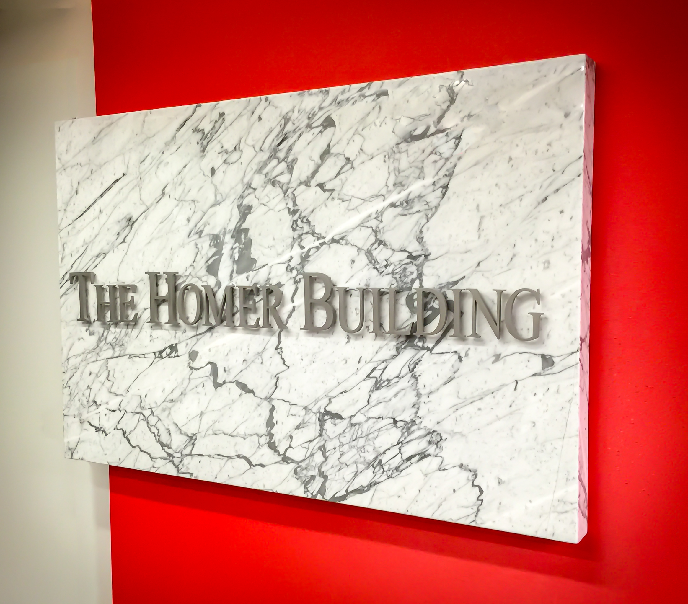 white carrara marble signage
